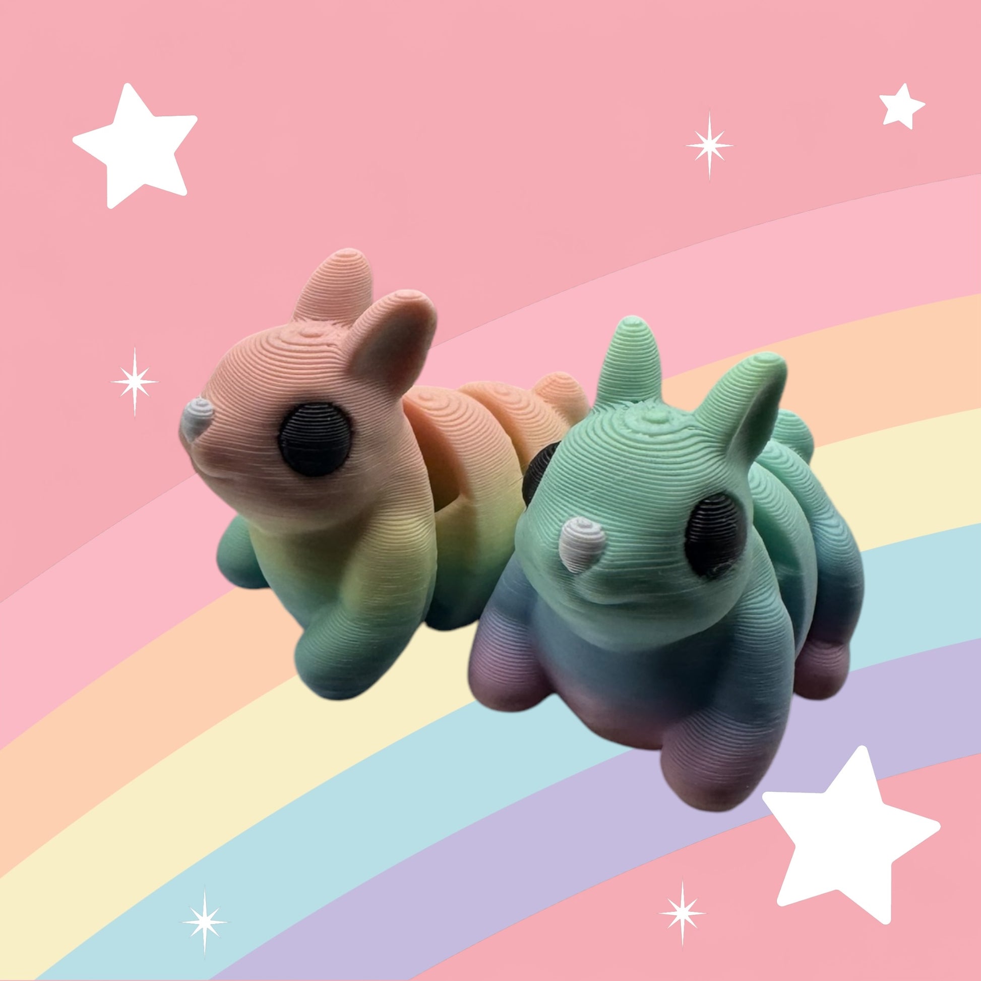 rainbow friends bunniesMeet Thistle – a rainbow-colored, 3D printed articulated bunny from Whimsizoo. A playful fidget friend perfect for kids, collectors, and bunny fans!