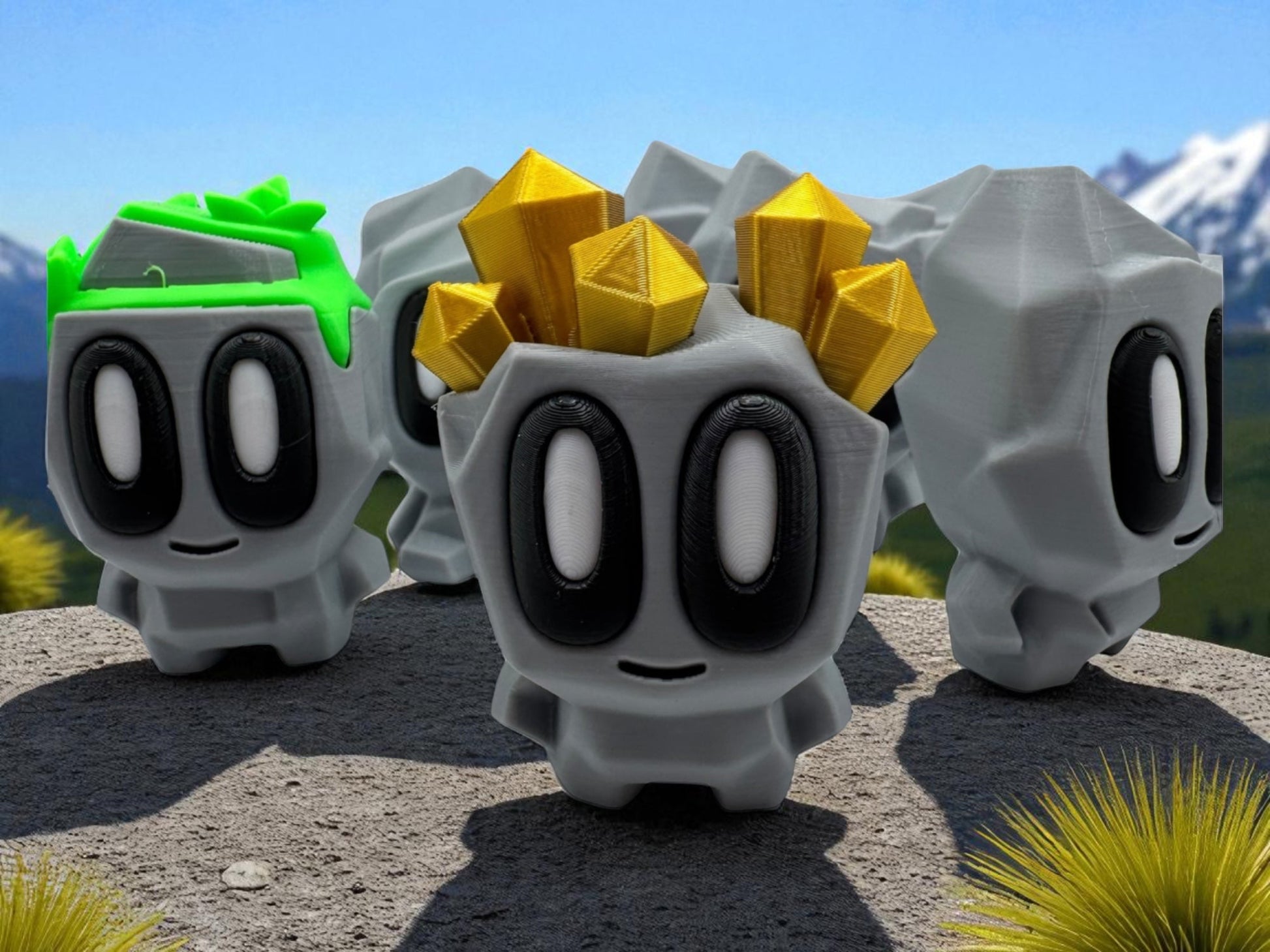 Four gray characters with black eyes and white pupils, one with green hair, one with gold hair, and two with no hair, on a rocky surface with a mountainous background.