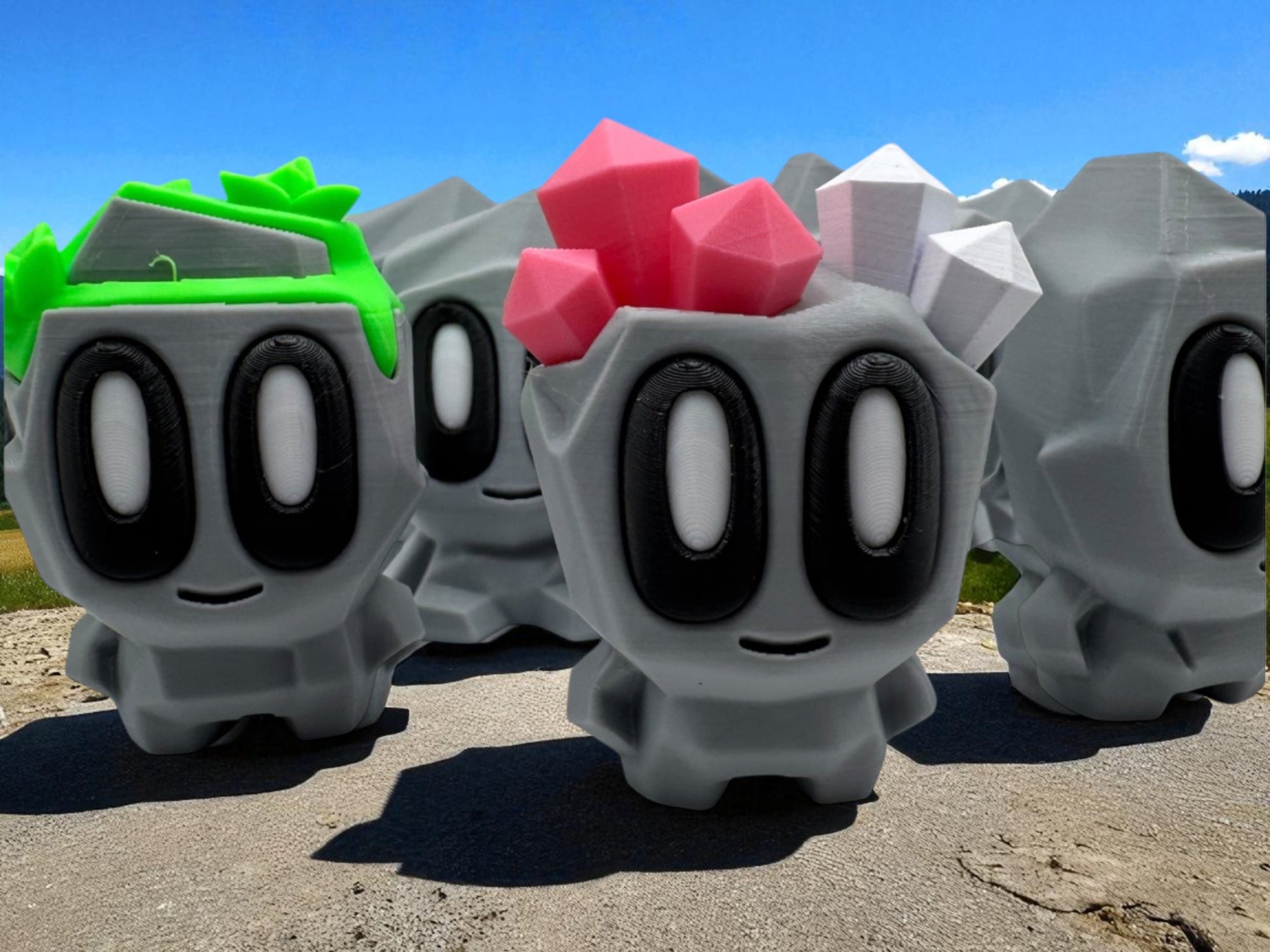 Row of gray character figurines with colorful accents on a road