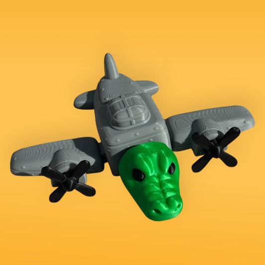 Toy airplane with a green head on an orange background