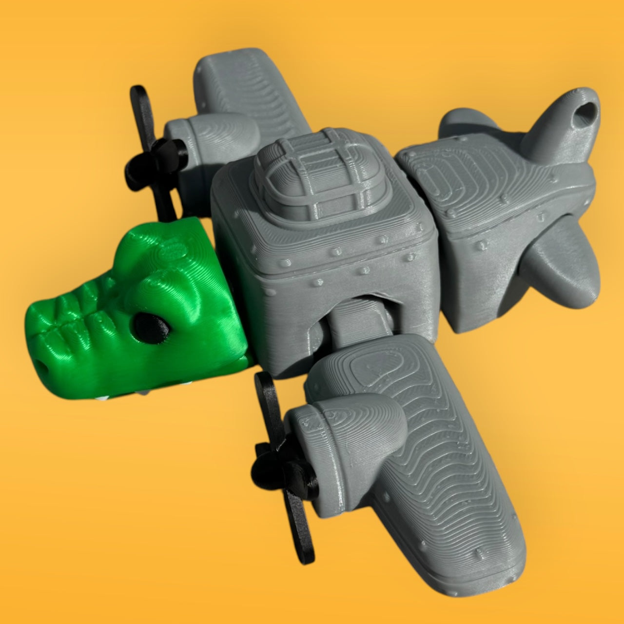 Gray and green plastic clamps on a yellow background