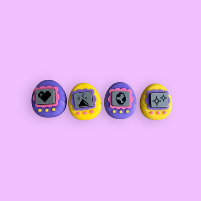 Four vintage-style digital toys on a pink background