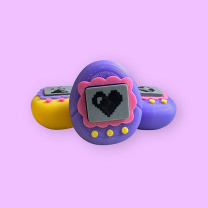 Purple and yellow toy with a heart display on a pink background