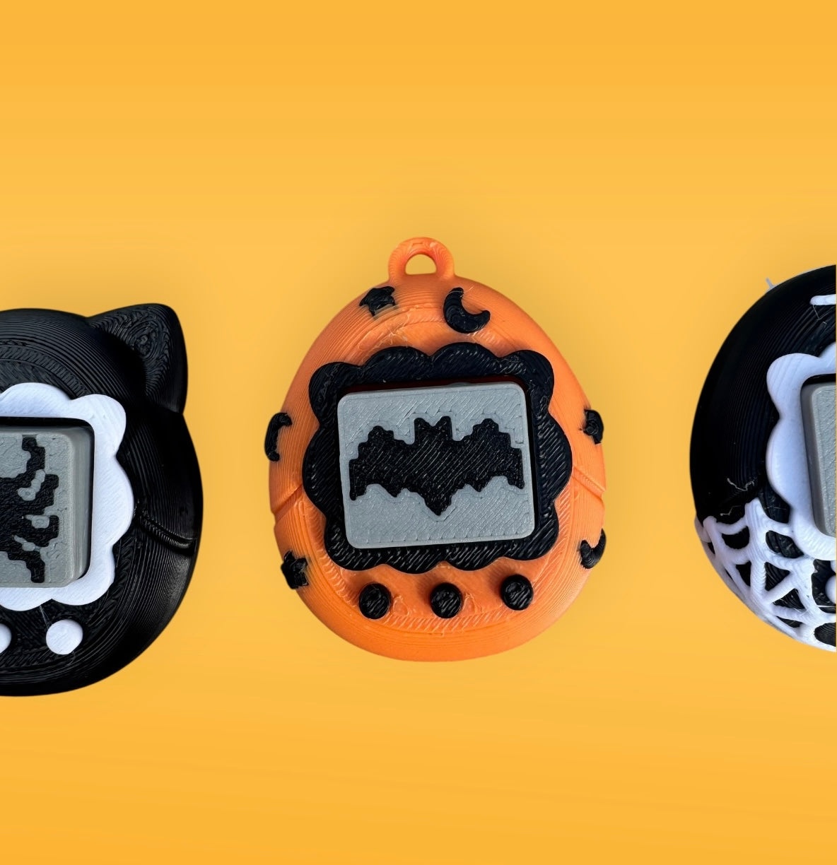 Three Halloween-themed digital pendants on a yellow background